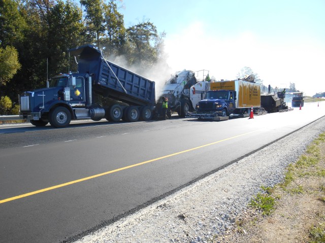 Joint heating on two lane highway with offset transfer machine.