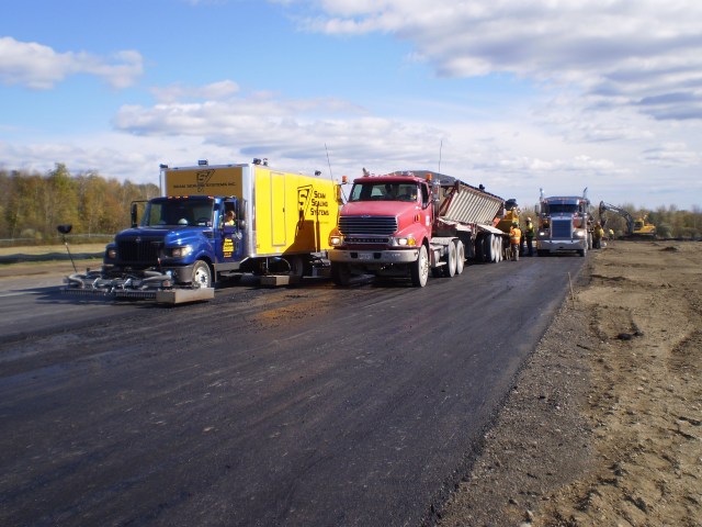 Full width paving with guaranteed hot joints.